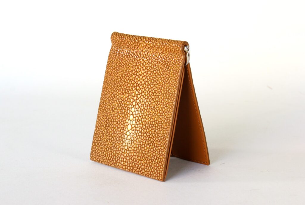 Orange stingray leather wallet by AKNAS featuring a textured finish and slim bifold design.