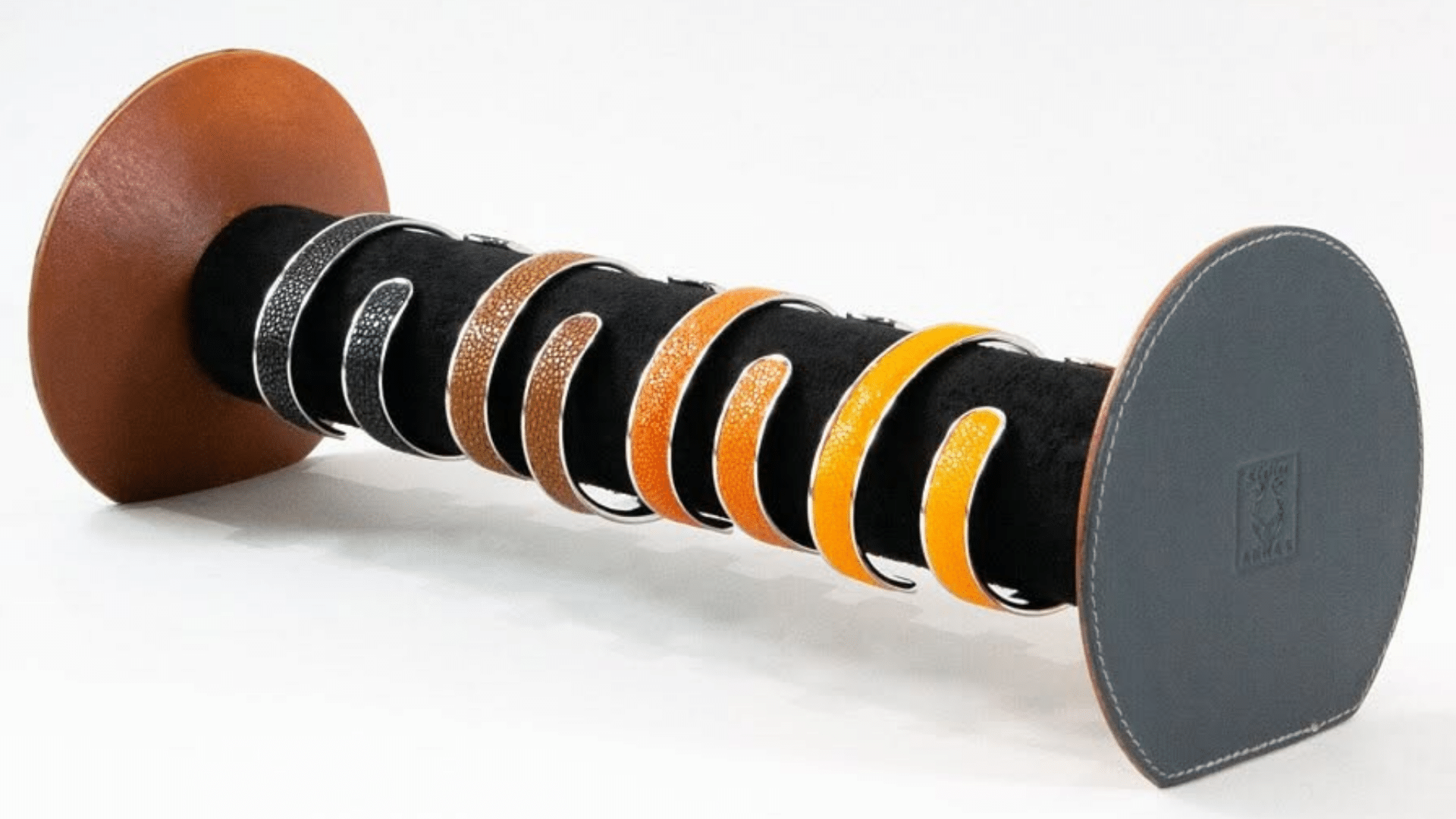 Collection of stingray leather bracelets displayed with different colours and textured finishes